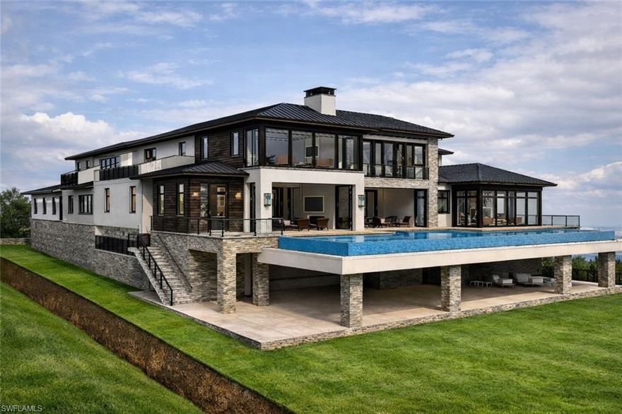 PRE-CONSTRUCTION PRICING | GULF FRONT ESTATE!! Take advantage of pre-construction pricing on a rare opportunity to own a legacy beachfront estate along one of the most coveted stretches of Gulf Shore Boulevard South. Set on nearly one acre with direct Gulf frontage, this property offers panoramic water views, exceptional privacy, and immediate access to Naples’ signature white sand beaches.
Thoughtfully designed by Kukk Architecture & Design, the planned residence features approximately 10,000 square feet of air-conditioned living space with 7 bedrooms plus a study, 7 full baths, and 3 half baths. Built to current hurricane standards and elevated construction requirements, the home is designed for both resilience and peace of mind while maximizing views.
A defining architectural element is the elevated approach, allowing residents to drive directly up to the front entry and into a private 3-car garage positioned at the main living level—blending convenience with elevated coastal design. The lower level features an expansive collector’s garage accommodating approximately 20 vehicles, along with an additional 3-car garage.
The outdoor living experience is anchored by a stunning infinity-edge lap pool positioned on the main living level, designed to visually merge with the Gulf and create a seamless horizon line from the home to the water. Oversized lounge areas and terraces are thoughtfully arranged to capture sunset views and true waterfront living.
Built with concrete construction and equipped with natural gas, the property also includes a detached guesthouse with a private bedroom and spacious living areas.
Ideally located just minutes from Fifth Avenue South and Third Street South, this is a true generational offering—combining scale, design, and location in one of Naples’ most prestigious beachfront settings.




One or more photo(s) has been virtually staged, AI generated or rendered.