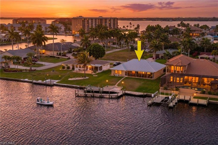 Extra wide 200+ foot intersecting canal with massive wide water views. Western rear exposure. Direct sailboat Gulf access with no bridges, deep water, and just seconds to the Caloosahatchee River and open water. Heavy boat traffic including tiki tours. Located in SE Cape Coral on an oversized lot in the Orchid neighborhood near South Cape dining, shopping, and downtown conveniences, with Slipaway food truck park right around the corner. City water and sewer are in and paid.
Approximately 2,000 square foot waterfront home with immediate wide water views from the entry and main living areas. Open layout from kitchen to living room.
Updated kitchen with wood cabinets, granite countertops, glass display uppers, stainless appliances, pass-through window, and slider to the lanai.
Primary suite with a wall of windows overlooking the intersecting canal, large walk-in closet, dual sinks, and separate tub and shower. Guest baths include dual sinks and one has direct lanai access for use as a future pool bath. Plenty of room to add a pool.
Large screened lanai designed to capture the wide water views with multiple access points from kitchen, living room, primary bedroom, and guest bath. Electric roll-down shutters on the lanai plus additional hurricane protection.
Metal roof, 2021 AC, larger laundry room with utility sink and workspace. Brick paver walkway to dock with water and electric. Dock and lift need repair.