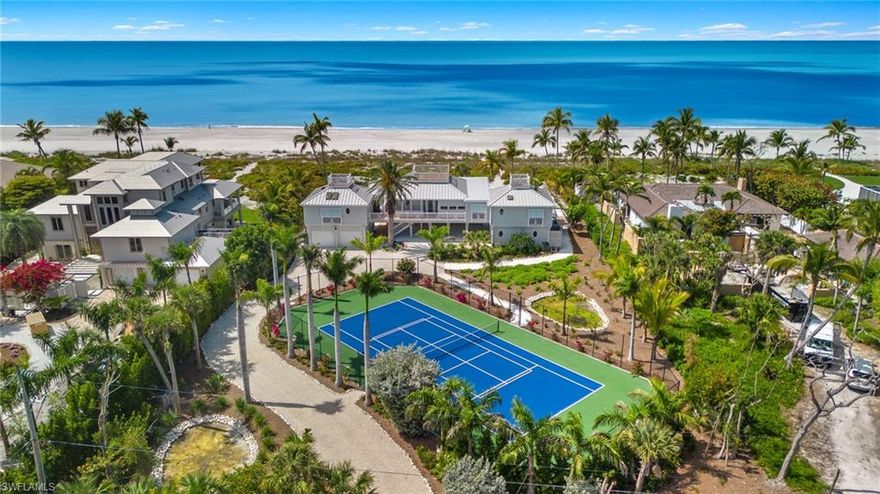 Born from a singular moment of inspiration, this extraordinary Gulf-front estate was conceived by an architect who understood that certain locations demand reverence rather than dominance. What emerged is not simply a home, but a living tribute to Sanibel Island itself, one that dissolves the boundary between architecture and nature, land and sea, horizon and sky. From the outset, the residence was engineered well ahead of its time, constructed with a foresight and structural integrity rarely found, even today. Its design philosophy is elegantly simple yet profoundly impactful, to honor the Gulf. The home stretches gracefully along 150 feet of pristine beachfront, its horizontal lines mirroring the distant horizon so that the turquoise waters become the defining feature of daily life. Nearly every room is oriented toward the sea, ensuring that the rhythm of waves, shifting light and endless sky are ever-present companions. Walls of glass invite the Gulf indoors, while expansive wraparound porches create an immersive, open-air experience, ideal for sunrise reflections, afternoon breezes and evenings washed in gold. Here, the views are not framed, they are uninterrupted, panoramic and deeply moving. Inside, the residence unfolds with a refined warmth that balances artistry with comfort. Every detail has been thoughtfully curated, from custom cabinetry handcrafted by a master furniture maker to the rare beauty of curly maple countertops, whose natural movement echoes the fluidity of the shoreline. Timeless Australian Cypress Pine flooring grounds the interiors with organic richness, while vaulted beadboard ceilings lend a sense of airy elegance and coastal authenticity. The result is an interior that feels elevated and effortless, sophisticated without pretension. Set on more than 1.4 acres, this rare expanse allows the property to function as a private resort, with room for recreation, reflection and retreat. Remarkably, the grounds accommodate a full-size tennis or pickleball court, a feature almost unheard of in beachfront settings and a testament to the property’s exceptional scale. Ascending above it all, rooftop sundecks provide a breathtaking vantage point, an elevated sanctuary where the Gulf stretches endlessly in every direction. These are spaces made for gathering, celebrating, and bearing witness to sunsets that dissolve into shimmering water, night after night, in spectacular fashion. At water’s edge, a private beachside pool offers a serene counterpoint to the Gulf beyond, a place to cool off after sun-soaked days on the sand, or simply to relax as palm shadows dance across the water. This is not merely a beachfront home. It is an experience. A legacy property. A place where architecture, craftsmanship and nature exist in harmony. On Sanibel Island, where Gulf-front estates are finite and increasingly rare, this residence stands apart, captivating, timeless and utterly unforgettable.