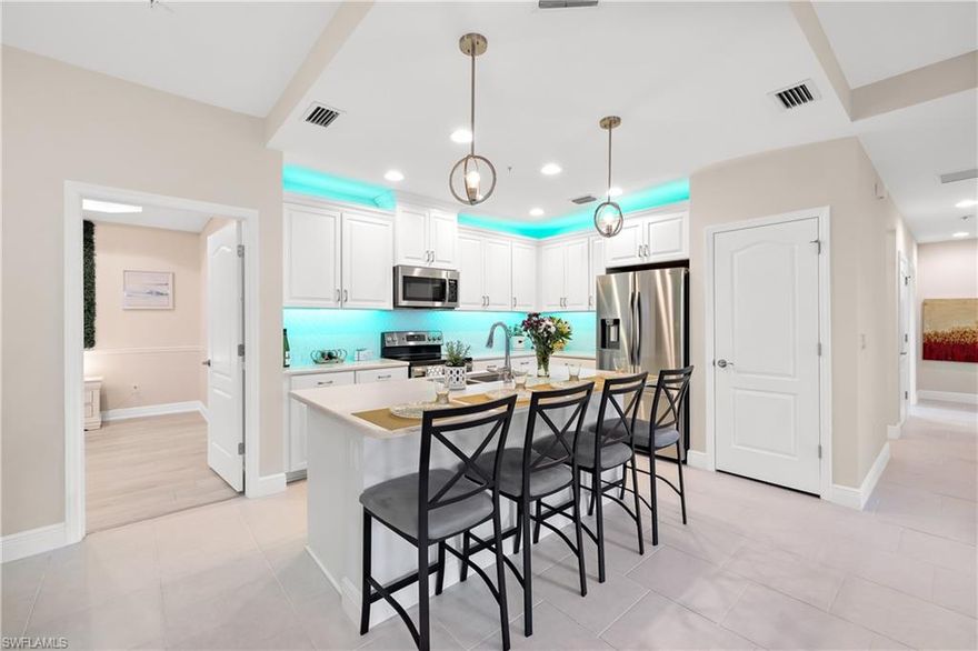 Exceptional Vacation Turnkey Furnished Condo JUST FOR YOU! Luxury entertain in this beautiful End unit and Bright Condo! Immaculate and clean condo with wonderful finishes including LED under cabinet kitchen lighting, new Stainless fridge, new flooring, new lighting throughout and impact windows and doors! Wonderful location Just 4 Miles to I-75 Highway and 9 Miles to the beach. Your Condo Dues Include EVERYTHING Just pay your Electric! This North Naples gated community only has 104 Condos for a small, intimate, friendly setting for walking and meeting new neighbors. Located near amazing new shopping just around the corner. Come grab your slice of paradise today!