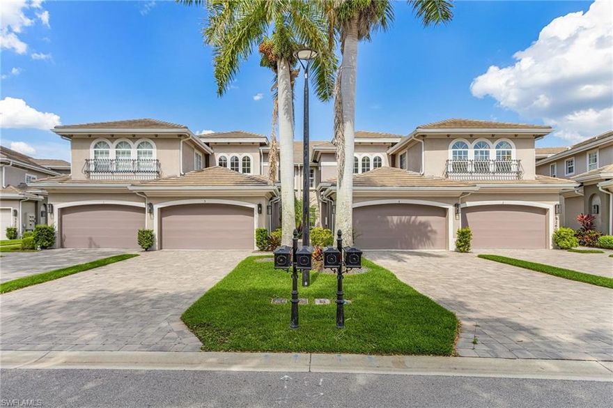 Beautifully renovated, turn-key furnished carriage home in the Triana neighborhood of The Club at Renaissance — one of South Fort Myers' most sought-after private golf communities. This exceptional second-floor residence offers 2,802 sq ft of refined living with golf course and lake views. The ground level features a private entry, two-car garage, and your choice of an elegant wrought iron staircase or private elevator to the main living floor. Upstairs, soaring ceilings and a dramatic arched colonnade with decorative columns define the open great room, which flows to the screened lanai overlooking the Arthur Hills championship course. The lanai is equipped with electric roll-down storm shutters for year-round convenience. The renovated kitchen features white raised-panel cabinetry with gold hardware, quartz countertops, geometric tile backsplash, under-cabinet lighting, stainless appliances, and a peninsula with bar seating. A breakfast nook with corner windows frames golf course views. The utility room offers a front-load washer and dryer, quartz countertops, utility sink, and ample cabinetry. The primary suite features a walk-in closet, tray ceiling, hardwood floors, and golf course views. The en-suite bath includes a double vanity with granite countertops, soaking tub, and walk-in glass shower. Two guest bedrooms offer tray ceilings, hardwood floors, and plantation shutters. The den is an ideal home office. The oversized media room features triple arched windows, plantation shutters, a built-in bar with wine cooler, and hardwood floors. The Club at Renaissance is a private, gated community on 500+ acres featuring an Arthur Hills championship golf course, resort-style pool and pavilion, full-service spa and fitness center, six red clay tennis courts, two pickleball courts, two bocce courts, and a children's play area. Year-round dining and social programming complete the lifestyle.