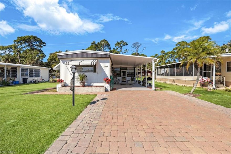 Welcome to Imperial Bonita Estates, a vibrant 55+ resident-owned cooperative community in the heart of Bonita Springs known for its active and social lifestyle.

This well-maintained 2 bedroom, 2 bath manufactured home features a split floor plan, open kitchen and dining area, spacious laundry room, and an attached workshop plumbed with electric and water — ideal for hobbies, projects, or additional storage.

Outdoor living includes a screened lanai and a spacious back patio overlooking a peaceful wooded lot for added privacy. The covered carport provides parking or additional outdoor living space.

Sellers are relocating north and have priced the home to sell.

Imperial Bonita Estates is a golf cart-friendly community offering a full calendar of activities and social events year-round. Amenities include a brand-new oversized heated pool, river access with kayak and paddleboard launch, pickleball, tennis, bocce, shuffleboard, boat storage, and a fenced pet run. Residents enjoy an engaging atmosphere with regular gatherings, concerts, and community events.

Low community fees of $113 per month include trash removal and lawn service.

Conveniently located just minutes to Downtown Bonita Springs, Gulf beaches, dining, shopping, I-75, Fort Myers, Naples, and RSW International Airport.

Enjoy affordable Southwest Florida living in a welcoming and activity-rich 55+ community.