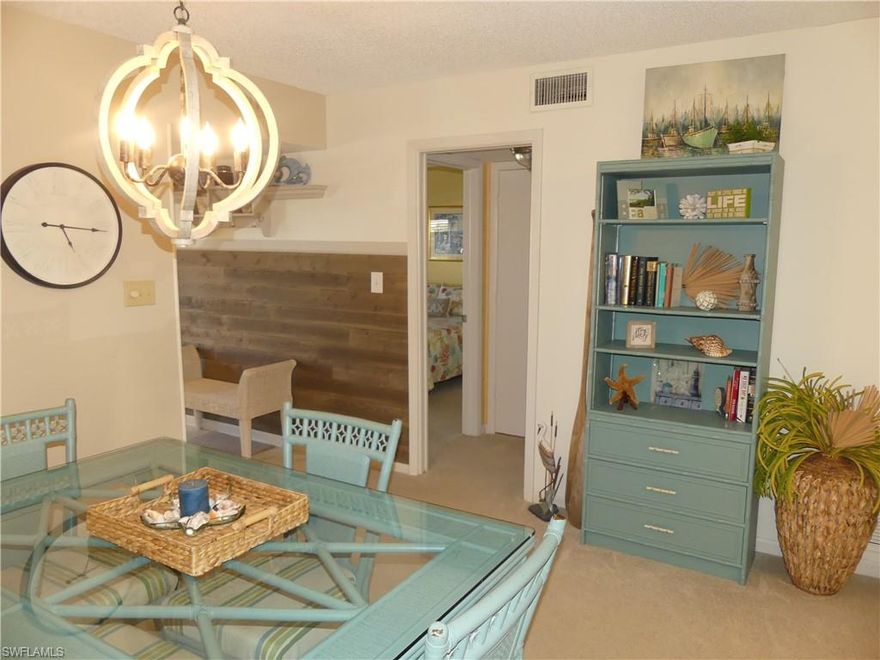 CHARMING 2/2 CONDO NEAR THE BEACH – FURNISHED, priced to sell, and public GOLF COURSE right next door!!!  Step inside to find a bright and airy living space with tasteful COASTAL DÉCOR...three amazing possibilities for this quaint condo with 1100+ sq feet of living space…an amazing opportunity for seasonal living, a rental investment, or a year-round residence in SUNNY NAPLES, FLORIDA…Ideally located just a few minute drive from pristine GULF BEACHES, Naples 5th Ave shopping & restaurants, and pickleball courts…Enjoy your private screened lanai balcony to bird watch over a serene waterway while experiencing the beautiful gulf breezes, or sit by the community pool to soak up the sun…This unit comes with a covered carport and is ready for your arrival!  Country Club Manor is a 55+ Community…Cable & Internet are included in Condo fee.