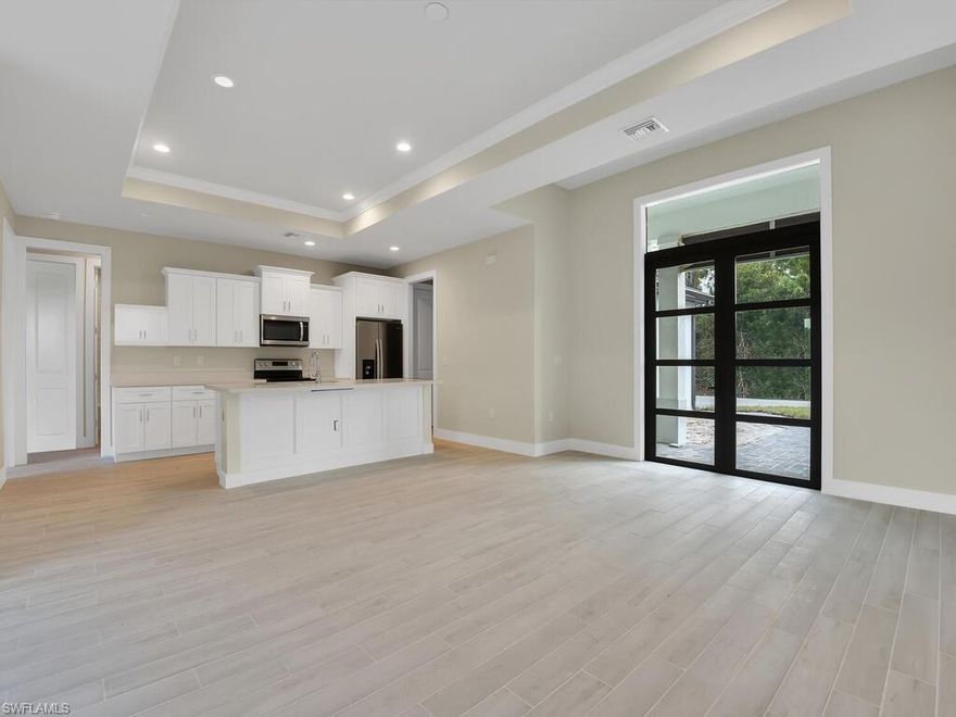 THIS HOME IS READY OCTOBER 29, 2021!! There are other homes in the immediate area just like this that are under contract already. NEW CONSTRUCTION SINGLE FAMILY HOME ON A LARGE LOT WITH NO ASSOCIATION DUES! The home is a 3 bedroom + large den with a closet and 2 designer spacious bathrooms. This home comes standard with a metal roof and impact windows & doors!  There are nearly 60 home sites in the immediate area to choose from. Many homes are already under construction! Gorgeous contemporary layout w/ open concept kitchen, split bedroom floor plan, luxury plank flooring throughout, quartz countertops, contemporary double door front entry, large slider system on rear of home, laundry room w/ utility sink, volume ceilings, walk-in closet & frameless shower enclosure in master bath, and 2-car garage. You will love this amazing home with top quality construction!