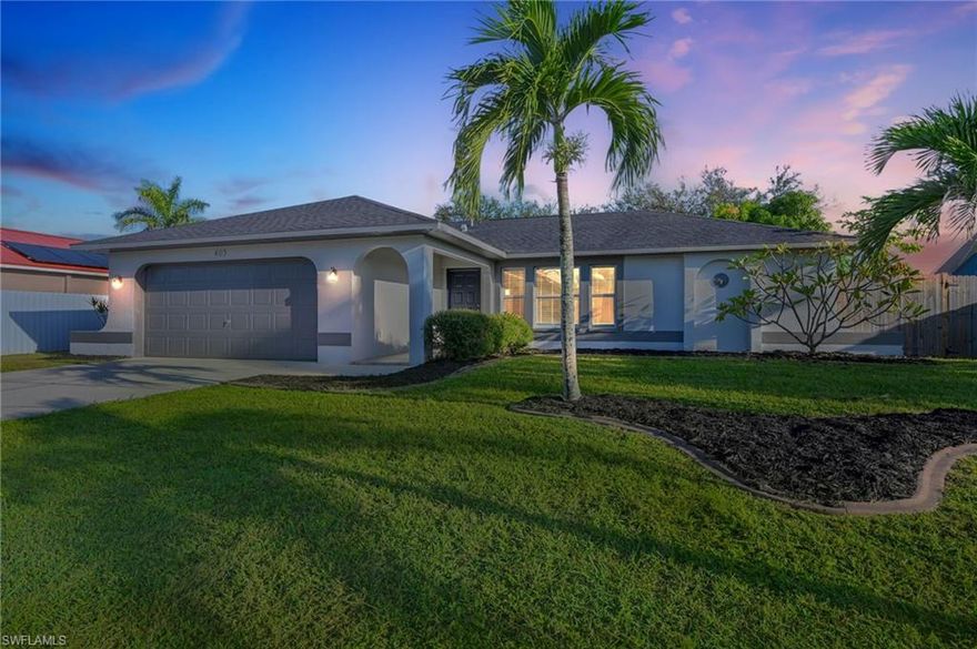 Welcome to this charming 3 bedroom, 2 bath home.  Perfectly situated between Del Prado Blvd, Santa Barbara Blvd and Veterans Parkway & the Midpoint Bridge, you are just minutes from everything you need for daily living, outdoor adventures and special nights out. Inside, you'll find a tastefully updated home waiting for you to start making memories.  Enjoy 2 nicely updated bathrooms including a 3/4 bath with walk-in tile shower. Ceramic tile floors throughout the main living area give the home a Southwester flare enhanced by the natural light and sunny disposition.  A fabulous kitchen with stainless appliances, center island and beautiful light wood cabinetry will make this the center of the home.  Perfect for entertaining your friends or family or whipping together a late lunch for yourself, this kitchen will soon be your favorite room in your new house.  A tidy fenced yard with a paver patio is perfect for relaxing in the cool breeze of the evening and a 2 stall garage allows room for your tools and toys. Welcome Home