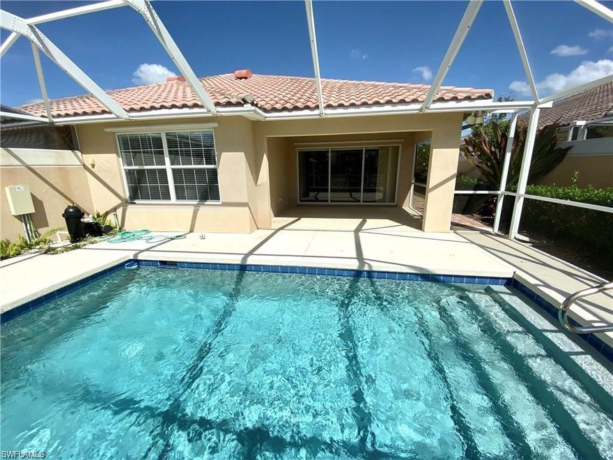 If you are looking for a meticulously clean two bedroom/two bath plus den Capri villa, this is it. This attached home is one of DiVosta homes original poured concrete built units. An open concept, split bedroom floorplan offers both spaciousness and privacy. A vaulted ceiling in the main living area adds loftiness. The villa has been freshly painted in neutral shades and the floors are a mix of tile, tile wood look flooring as well as some carpeted areas. This space is ready to have your personal decorative flair added to truly make it your own. Outdoors is a shaded, covered lanai leading to a screen enclosed patio with a refreshing heated, rectangular pool. A grassy lawn leads to a peaceful waterway which makes for a restful view while relaxing or entertaining. Verona Walk is known for its abundant amenities and town center. Stop at the café for lunch after you pick up mail at our own post office and grab a scoop of ice cream all within a two- minute drive from your home. Feel immediately welcome to a friendly community with a full roster of activities to keep you on the go.