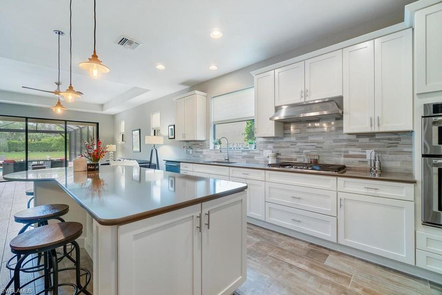 Stop looking because this is it! This 3 bedroom, den, 2 bath home in the natural gas community of Camden Lakes has a stunning salt-water pool with fire feature & spa. Your expansive lanai with panoramic screen provides an unobstructed view of the tranquil lake setting & is stubbed with gas & water to create the perfect outdoor oasis. The chef in you will love the deluxe, gourmet kitchen with all top of the line Kitchen Aid appliances including a 5 burner gas cook top, double wall ovens, French door refrigerator, & wine cooler. Relax in your spa-like master bath featuring oversized shower and decorator finishes. Wide-planked, wood finish tile & neutral paint complete the coastal feel of your beautiful, like-new home. You'll never run out of space for your toys & belongings with the extended garage & expanded attic storage. Zoned for all A-rated schools: Veterans Elementary, North Naples Middle, & Gulf Coast High. You've found your new home, the only thing it's missing is YOU!