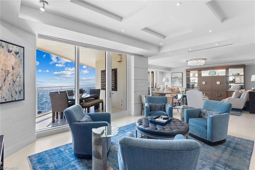 Unmatched luxury awaits in this exquisite turnkey beachfront condominium in Moraya Bay. Boasting three bedrooms, a den, study and 3.5 baths, this residence is designed for refined living. Step off your private elevator into a home that radiates sophistication. The chef’s kitchen features top-of-the-line appliances, including a natural gas range, double ovens, a separate ice maker, and multiple refrigerators, ideal for gourmet entertaining. The expansive primary suite offers a tranquil retreat with a spa-like bath and floor-to-ceiling glass sliders that frame breathtaking ocean views. Two additional guest suites provide comfort and privacy for family or visitors. Unwind on the wraparound terrace, fully equipped with an outdoor kitchen, and enjoy panoramic views of the gulf and mesmerizing sunsets. On Vanderbilt Beach, Moraya Bay is a pet-friendly community with five-star amenities including a gourmet restaurant and bar, two resort-style pools, concierge service, chair and towel service, a fitness center and 24-hour security. Membership includes access to The Floridian Club and The Club at Kalea Bay, ensuring an elevated coastal lifestyle. Experience beachfront living at its finest!