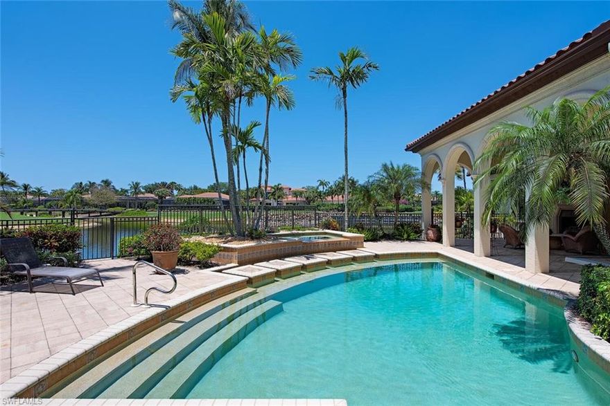 Welcome to Resort Style Living, Welcome to Grey Oaks. Enjoy spectacular 180-degree water/golf course views from nearly every room. The beautiful home with southwestern exposure overlooks the 13th fairway of the Palm Golf Course. THE GRAND RESIDENCE HAS NEW INTERIOR PAINT AND BEAUTIFUL UPDATED LANDSCAPING!  This one of a kind home features 5,596 square feet of living area with a spacious living room, formal dining room, chef’s kitchen, family room, 3 car garage and vast outdoor living area. Entertaining is a breeze with the resort-style pool & spa accenting the outdoor kitchen and living area complete with an outdoor fireplace. Grey Oaks Country Club is Naples one and only private club with 54 holes of golf. In addition, the club offers exclusive amenities for all, from the newly renovated wellness center to the lagoon-style pool, tennis, pickleball, bocce, restaurants, spa… the amenities are endless.