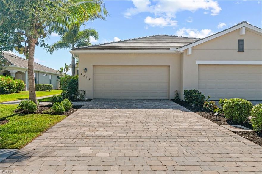 Enjoy this Bright & Inviting Attached Villa in Castelina in Fort Myers! This home offers three bedrooms, two full baths, attached garage and over 1,561 sq ft of living space.  Located in the heart of this gated community, you'll love the sidewalks, community pool, clubhouse, cabana and workout room!  Enjoy amazing sunrise views across the lake from your large private lanai! The owners suite provides his and her sinks, tiled, walk-in shower and copious cabinetry. Additional features include: tile flooring throughout, crown molding, granite countertops, custom closet cabinetry!  Call today for your private tour!