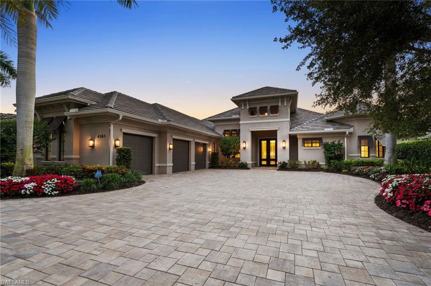 Step into luxury with this beautifully updated home offered turnkey and recently enhanced with newer premium features throughout. Enjoy immersive sound throughout via the brand-new audio system and test your culinary skills in the gorgeous gourmet kitchen featuring stainless steel appliances, two islands, two ovens and a spectacular butler’s pantry complete with wine refrigerator, beverage drawers and ample storage. The recently renovated great room is anchored by a stunning white Carrara porcelain feature wall—elegantly backlit—to create a striking focal point. Beautifully appointed throughout, the furniture is both sophisticated yet inviting.  Relax in the primary bedroom with all-new flooring, custom closets and spa-like bath. The oversized lanai, with plenty of entertaining, relaxation space and all new furniture offers something for everyone including privacy with tranquil sunny views of the natural surroundings. Showcasing the new outdoor fireplace is a sleek porcelain accent wall and the fully equipped outdoor kitchen offering ease of entertainment with a brand new grill and an oversized island topped with exquisite white Thasos quartz. Feel secure and keep out the elements with retractable hurricane shutters while additional features and upgrades offer a state-of-the-art Navion water system, full house generator, tankless recirculating water heater, 3 car garage and much more.