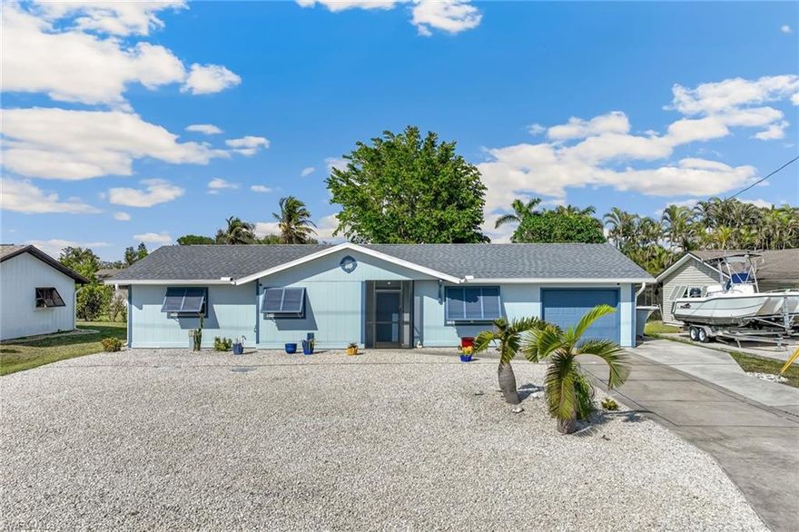 BOATING COMMUNITY. 25 MIN TO GULF. COMMUNITY BOAT RAMP! Beautifully updated home in a community without a lot of restrictions. Tired of homes on small lots in a neighborhood with a lot of restrictions? Then this home is for you. This completely remodeled home sits on a larger 80x100' lot. The driveway is extra large- perfect  to park your boat or RV. Spacious 2 bedroom with den, 2 bath home offers over 1,600 sq. ft. of living space, including a versatile den/bonus room overlooking the backyard that can easily be converted to a 3rd bedroom. The bright, modern kitchen features white wood cabinetry with spice cabinet, pull-outs, granite countertops, a center island with cooktop and stainless hood, Whirlpool stainless appliances, pantry and a breakfast bar for four. Tile flooring throughout, updated baths, and a spacious primary bedroom with ensuite bath. This home has been carefully remodeled with quality upgrades: hurricane-rated impact (bonus room has non-impact double paned windows), new roof (2022), new HVAC (2024), new water heater, plus stylish Bahama shutters. Upgrade list attached to the MLS. Step outside to enjoy a spacious backyard and screened lanai, perfect for relaxing after a day on the water. All this, just 20 minutes from the beach and close to the airport, Gulf Coast Town Center, Coconut Point Mall, and more. Whether you’re seeking a full-time home or the perfect vacation retreat with boating at your fingertips, this property is ready to welcome you—just bring your flip-flops.  Reasonable flood insurance policy is in place and assumable. HOA fees only $240 year. This home is a must see in this price range as it has quality upgrades throughout.