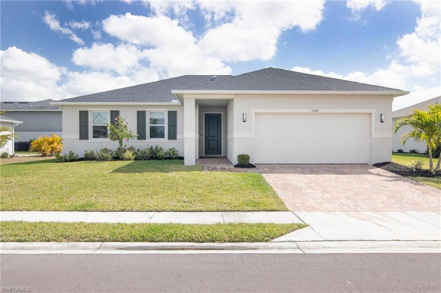 Welcome to this beautifully built 2023 lakefront 3 bedroom, 2 bath home offering the perfect blend of modern comfort and scenic views. Inside, you’ll find an inviting open layout with volume ceilings that enhance the bright and spacious feel of the main living areas. The well-appointed kitchen is ideal for both everyday living and entertaining, featuring a large island with additional storage, breakfast bar, pantry, and stainless steel appliances. The primary suite provides a relaxing retreat with a walk-in closet and a beautifully designed bathroom that includes a dual-sink vanity and a walk-in shower with built-in bench. Luxury vinyl plank flooring runs throughout the main living areas, while the bedrooms are comfortably carpeted. Step outside to the covered rear patio overlooking the lake, perfect for enjoying quiet mornings or relaxing evenings with scenic water views.
Additional highlights include a pavered driveway and modern construction offering low-maintenance living. Gutters have also been newly installed. Enjoy the added benefits of living in a secure gated community with access to a clubhouse and community pool, making this home the perfect combination of comfort, convenience, and lifestyle.