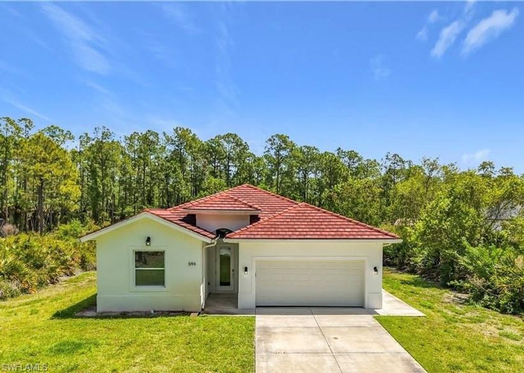 Photo of 594 31st ST NW, NAPLES, FL 34120 (MLS # 226015349)