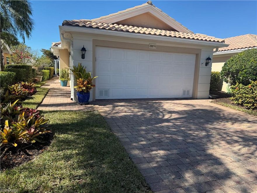 This thoughtfully updated Capri model is your cheerful escape to paradise—coastal charm. Inside, you'll find quartz countertops, a coastal-style backsplash, large sink, updated cabinets, newer stainless steel appliances, and plantation shutters. The extended lanai overlooks a beautiful pool and lake view, framed by picture-screen panels for unobstructed scenery. Recent updates include: A/C, water heater, washer/dryer, electric storm shutters, updated lighting and fans, leaded glass front door. No carpet - tile and wood flooring, crown molding adds a touch of coastal elegance. Built by DiVosta with solid poured concrete and rebar construction—true quality you can count on. Located in Village Walk, where resort-style amenities await: 8 lighted tennis courts, 3 pickleball courts, bocce, resort and lap pools, 24/7 fitness center, restaurant, salon, car wash, gas station, and more. Enjoy scenic walking paths, butterfly gardens, and native bird watching. Minutes from Bonita Beach, great dining, RSW Airport, and the new Midtown at Bonita. Low HOA & Pet Friendly!