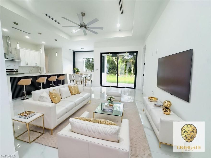 Stunning new construction in the growing community of Lehigh Acres! This modern 3-bedroom, 2-bath home showcases a sleek, open-concept design with high-end finishes throughout. The bright and spacious kitchen features a large quartz waterfall island, custom cabinetry, stainless steel appliances, and elegant pendant lighting—perfect for entertaining. Enjoy luxury tile flooring throughout, high ceilings, and abundant natural light from oversized windows and sliding glass doors that lead to the backyard. The contemporary exterior offers clean architectural lines, a paver driveway, and a welcoming entryway. The primary suite provides a private retreat, while two additional bedrooms offer flexibility for family, guests, or a home office. Conveniently located near shopping, dining, and major roadways, this home combines style, comfort, and functionality. Don’t miss the opportunity to own this beautifully designed home in a rapidly developing area!