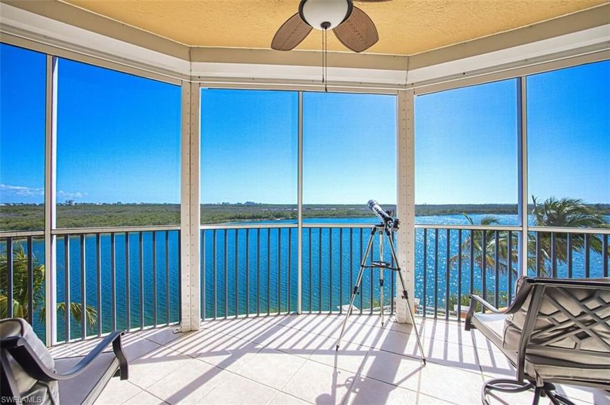 Water surrounds this condo providing the feeling you are living on a boat, more accurately, a 3BR/3BA 2473’ boathouse. A secured elevator lifts you up & opens to a private foyer. Double doors lead into an open, spacious & light-filled great rm w/crown molding. Floor to ceiling, sliders w/impact glass & a LG window w/plantation shutters frame the water view including a 25-acre glistening lake to the S. To the W, a crystal-clear lagoon is framed by more floor to ceiling sliders. The Bay & Gulf sparkle on the horizon, over the 700+ acres of preserve. Luxury vinyl floors run throughout the living spaces. Two lanais (I is off living area w/ S exposure & the other is off dining area w/W view), both w/new screening, Storm Smart shades & tile floor provide outdoor living/entertaining space. The dining area affords you the opportunity to eat meals w/water views on two sides. The kitchen is centralized & open to the dining/living areas as well as a bonus area which can be used as a BRKFST rm, seating area or office. The SS GE Profile appliances-built-in oven w/warming tray & built-in microwave, dishwasher & French door/bottom freezer refrigerator were replaced in ‘25. The kitchen also features a glass cooktop, tile backsplash, under counter lighting, wood cabinets w/granite counters & 2 BRKFST bars. 
The primary suite has a water view through a LG window w/ plantation shutters, carpet, access to the S lanai, crown molding, 2 WICs & in-suite BA featuring WIS w/frameless shower door, soaking tub, wood cabinets, 2 sinks & WC. 
Two carpeted guest rms are located on the opposite end of the condo providing owners privacy from overnight guests. One of the guest rms is a secondary in-suite. The other guest rm is situated next to a 3rd BA. On the same side of the condo is a generous laundry w/deep sink, cabinets & closet for more storage. Another storage closet is steps outside the condo.  
Two under bldg. parking spaces & dehumidified storage rm convey. For an additional cost, an a/c storage rm is also avail. HVAC & water heater were replaced in ‘23. A whole house water filtration system conveys. This ‘boathouse’ can be purchased turn-key furnished. 
Situated on 50 tranquil acres w/25-acre lake, Mastique provides a low-density resort lifestyle. A 1-mile shell walking/jogging path surrounds the lake’s perimeter while a lakeside beach offers a place to launch a paddle boat or kayak. Expanding your personal living space is a 6000+ sq ft completely renovated clubhouse w/fitness center, yoga studio, billiard/game rm, gathering area, dining rm, kitchen, meeting/media rm, screened lanai & alfresco dining area. The 0-entry pool is organically shaped w/salt-water system. Both pool/spa sit on the lake’s N edge. Refurbished tennis & Pickleball courts are avail for resident use. Your canine kids have not been over-looked, there is a designated dog park for your fur-babies. 
BONUS – ideal location – walk to a beach, restaurants, grocery, & shops. Bike to Sanibel & FMB.