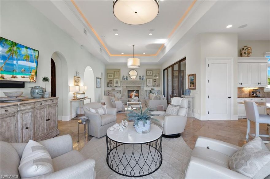 Panoramic, unobstructed views of the golf course, lakes and meandering streams can be enjoyed in this timeless Talis Park residence.  Impeccably maintained and a one of a kind custom floor plan masterfully constructed by WCI.  Perfect for the inspired home chef with two large pantries, natural gas, two dishwashers and an expansive, seamless island. The summer kitchen provides additional entertaining possibilities.  The great room affords multiple seating areas and a gas fireplace. Tranquility awaits in the peaceful primary suite and sitting area.  Three ensuite bedrooms, two half baths (one powder and one in the summer kitchen area), a golf cart garage and two additional garage spaces, honed and filled Travertine tile, electric screens for the summer kitchen and porch and arguably the prettiest place to enjoy sunsets each day!  Located at the end of a quiet cul de sac for additional privacy.  Talis Park offers a busy social calendar, an award winning clubhouse, a recently renovated golf course (current wait list), several dining options, tennis, pickle ball, bocce, two dog parks, a beach runner, spa and workout facilities.