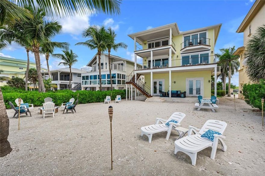 H3468.  Opportunity knocks! Gulf Front Bonita Beach home with direct access to the sand and surf. This professionally decorated 4 bed, 4 bath, 2562 sq/ft home comes fully furnished and is turn-key ready to enjoy. The Master Bedroom features a private balcony, walk-in closet and en-suite bath with large walk-in shower and separate soaking tub. Spectacular views and sunsets await you from the screened-in deck off the dining area or relax on the open deck off the living room. 2- car garage, multi-purpose room with bath and covered patio on the ground-floor level that can be used as additional entertainment space or guest quarters. Entertain your guests around the firepit on your sandy backyard or add an elevated pool and spa if desired. Ideally located within minutes to Doc's Beach House, Coconut Point and Mercato. INCREDIBLE RENTAL INVESTMENT OPPORTUNITY WITH NO RENTAL RESTRICTIONS!