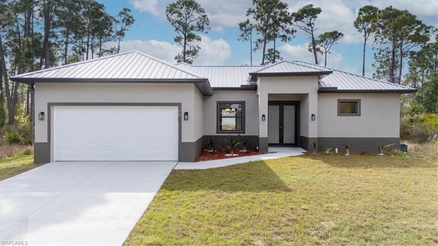 New Construction Home in Lehigh Acres offering the combination of quality finishes, functional design, and affordability. This 3-bedroom, 2.5-bath home features 9’4” ceilings with tray ceiling accents in both the main living area and primary suite, creating an open, elevated feel throughout. Tile flooring runs seamlessly through the entire home, complemented by hurricane impact windows and doors and a durable metal roof for long-term peace of mind. The kitchen is designed to be the centerpiece, complete with granite countertops, a large island ideal for gathering, pantry storage, and stainless steel appliances. The layout flows effortlessly to the covered lanai, extending your living space outdoors. The primary suite offers a private retreat with dual walk-in closets, a spacious bath, and direct access to the backyard through sliding glass doors. Located in Lehigh Acres, one of Southwest Florida’s fastest-growing and most affordable markets, this home positions buyers within reach of the Gulf’s renowned beaches, boating and fishing, golf courses, and scenic nature preserves. Convenient access to Florida Gulf Coast University, Florida SouthWestern State College, shopping, dining, and Southwest Florida International Airport adds to the appeal. No HOA. No flood zone. Affordable pricing makes this an exceptional opportunity for families, first-time buyers, or anyone looking for a move-in ready new home.