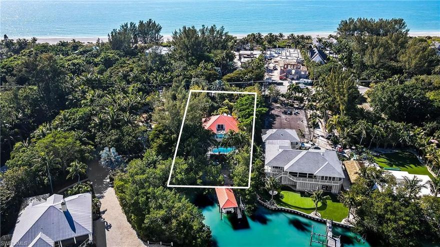 This beautiful, Roosevelt Channel, Olde Florida home is the perfect island get-a-way! Close to Captiva's sugar sand, shell strewn beaches & offering direct water access w/a rare boathouse, 20,000lb. boat lift & jet ski lift on a natural shoreline including a great kayak/SUP launch area. This 3 bedroom, 3 bath, pool home has Travertine floors throughout main living level and hardwood floors in the private, 2nd floor primary suite. The primary suite has vaulted/beamed ceiling & a private sunning deck w/water views. Primary bathroom has double sinks and custom glass tile. Recent upgrades include a new septic system, new electrical panel, 2-new a/c's, new washer & dryer, built-ins added to all bedroom closets, including new built-ins in pantry and a resurfaced pool. Plumbing fixtures by Water Works and some replumbing with Pex. Private and surrounded by tropical landscaping. Enjoy boating, fishing, shelling and stunning sunsets on Captiva Island. Sold furnished w/personal exceptions.