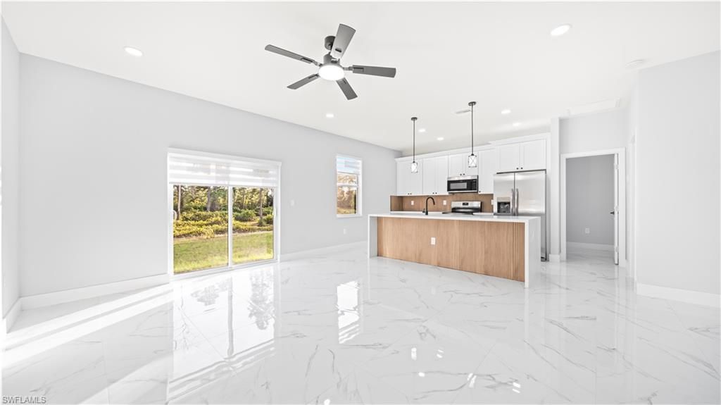 Photo of 311 Mangonia AVE, LEHIGH ACRES, FL 33974 (MLS # 225083176)