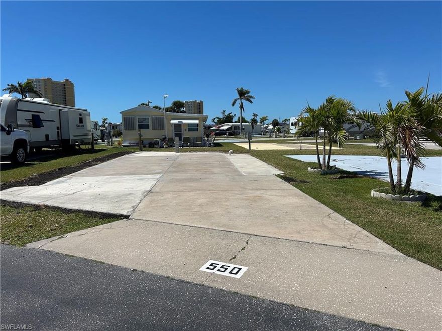 Embrace the tropical lifestyle at Palmetto Palms RV 55+ Condo HOA, where you own the land. This vacant lot is ideally located just a short walk from the community pool, clubhouse, and tennis courts. Electric is restored and  ready for RV hook up. Situated in a deed-restricted community, this lot provides an excellent opportunity to place your RV or build a park model home. Palmetto Palms offers resort-style amenities, including pickleball, shuffleboard, volleyball, horseshoe pits, and a scenic walking path over the lake. Boat storage is available, and Bunche Beach is within walking or biking distance. Enjoy an active and welcoming 55+ community in a prime location near shopping, dining, and outdoor recreation. Don't miss this opportunity to own a piece of paradise.