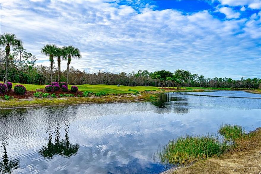 WONDERFUl 180 degree WATER VIEWS and the 2nd Hole Green  of Cedar Hammock Golf and Country Club's 18 hole Golf Course from the screened Lanai and Kitchen/ Living room. This 2 bedroom 2 bath condo has ALL NEW Stainless Steel Kitchen Appliances, and is freshly painted throughout .  BEST PRICED Condo in the development. Extra storage unit outside front entrance door.  Common elevator. Carport. Desirable floor plan gives Open kitchen area with superb views from living areas.    Cedar Hammock has had major improvements in 2025 with a luxurious Clubhouse pool with hot tub and waterfall, overlooked by Hammock restaurant, in addition to the main Clubhouse Dining and Veranda Dining with restaurant and bar.  Additional condo pool nearby.   Enjoy the 2 story Fitness Center with professional Trainer, Har Tru tennis, Pickleball, Bocce, and the many social events and community programs in this Active Club.  And most of all enjoy the 6,680 yard  18 HOLE Jed Azinger and Gordon Lewis designed Par 72 GOLF COURSE , with DRIVING RANGE, Pro Shop and well groomed putting green and separate chipping green.     Also,  from Cedar Hammock you can drive straight down Davis Blvd to Fifth Ave South and the world class BEACH, great restaurants and shopping.