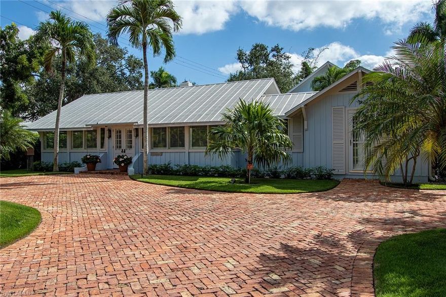 A prominent opportunity to own the famed Sagamore historic cottage. Located two blocks to the beach in the heart of Old Naples, this exceptional and rare landmark has been updated and maintained, preserving the essence of an Old Naples cottage with modern-day appointments. The main house outfitted with heart pine interiors offers an open living room with a gas fireplace, formal dining room, private study, spacious master suite with newly renovated bathroom and fixtures, and a cozy and calming guest ensuite. The kitchen reflects its authenticity with pine cabinetry and offers superior appliances and marble countertops. A separate three-story guest house features three bedrooms, two and a half baths, living areas, and a vaulted wood-beamed ceiling for an added eyeful of interest. The grounds have been meticulously maintained and provide privacy while the newer pool and spa invites relaxation. Close proximity to Third Street's cultural amenities complete this one-of-a-kind historical retreat.