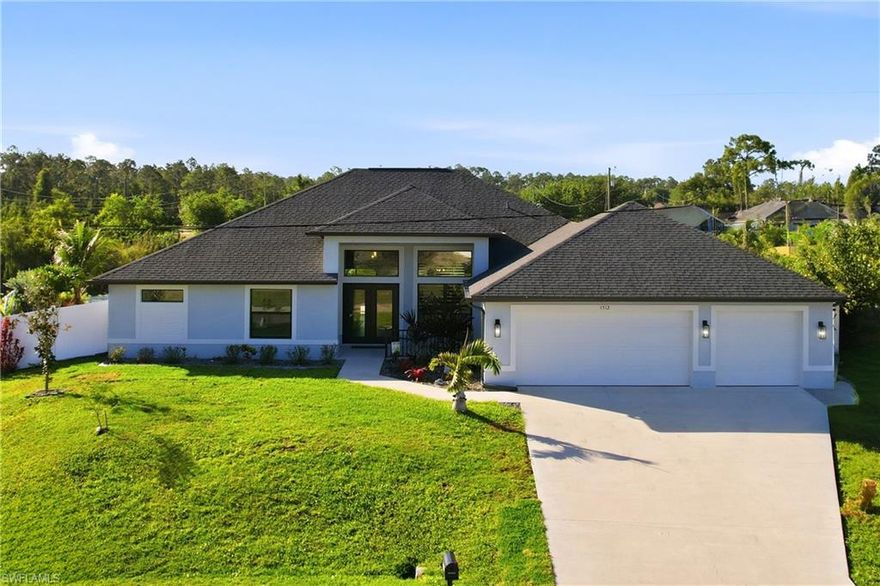 Experience this Amazing 2022 Custom Built Home on a Beautiful Freshwater Canal.  Offering over 2400 Sq Ft of Living Space, This Home is Designed to Impress!  Step outside to your Privatee Outdoor Oasis Featuring a Spectacular Pool with Oversized Sunshelf, Bubblers and Expansive Patio Area.  Perfect for Entertaining or Relaxing While Enjoying Peaceful Canal Views, Nature and Added Privace with a Fenced Yard!  The Kitchen Features White Cabinetry and Storage, a Large Center Island, Quartzite Island Top and Quartz Countertops, Premium Appliances, Hammered Copper Sink and Stylish Backsplash.  The Interior offers both a Grand Main Living Area and a Spacious Family Room, Providing Multiple Areas for Entertaining and Everyday Comfort. The Living Room Features Soaring Ceilings and a Dramatic Feature Wall with Fireplace, adding Warmth and Architectural Interest, While the Separate Family Room Offers a More Relaxed Setting for Gathering and Unwinding. Retreat to Your Primary Suite with a Luxurious Walk-In Shower and Separate Soaking Tub!  Need Room for Vehicles, Toys or Workshop?  The Oversized 931 Sq Ft of Garage Space Offering Endless Possibilities!  An Added Bonus:  The Adjacent Lot is Available to Purchase Providing a Rare Opportunity to Create a Private Family Compound or Multi-Generational Living! Refer to MLS # 2025017028.  NO FLOOD ZONE!