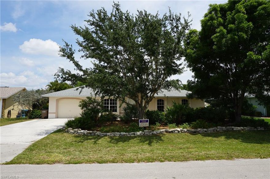 Quality home at the right price! Homeowner has meticulously maintained this centrally located gem and is ready to move on! Absolutely NOTHING to do here - this home is 100% move in ready! Nestled in Cape Coral close to schools, shopping, just MINUTES to ANYWHERE! This 3/2 is CBS construction with an oversize 1 car garage. Home features tile throughout, has a fresh coat of paint inside and out, decorative rails, plan shelves, stainless steel appliances & MORE! Upgrades include - 2015 re-screened lanai, 2012 new a/c, 2011 new roof, 2008 new tile throughout. Nature lovers MUST see as in 2007 this home was featured in FL yards and neighborhood's beautification project and was granted a makeover which included a native FL landscaping makeover.  This includes all native FL plants and shrubs that require no irrigation or pesticides. Good for the eyes and the environment!  ASSESSMENTS IN AND PAID! You must see this home NOW as it will not last! Call for your private tour today!