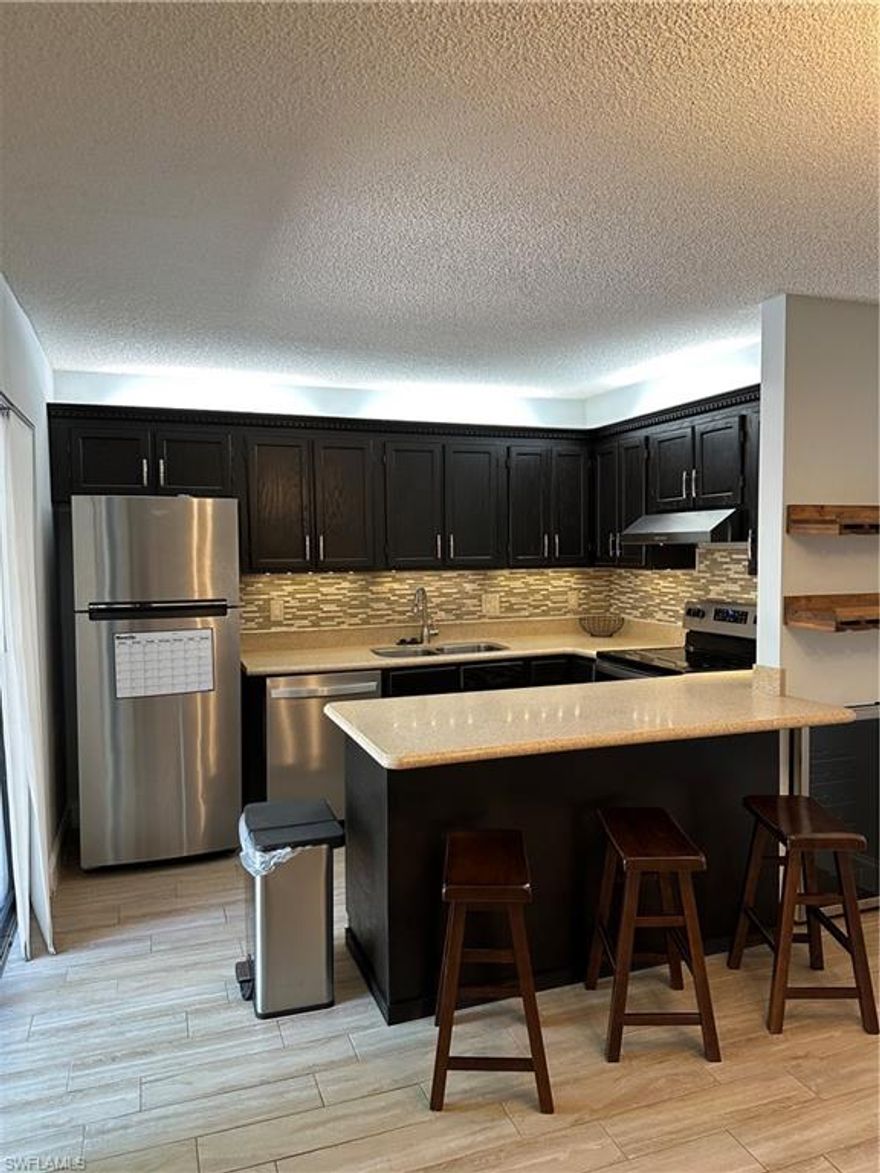 Welcome to your dream townhome in the heart of Fort Myers! This beautifully updated 2-bedroom, 2-bathroom home offers over 1,200 square feet of stylish, low-maintenance living. Step inside to find an open-concept main level featuring a modern kitchen with stainless steel appliances, a spacious dining area, and a bright living room with two sets of sliding glass doors that lead to a private, fenced courtyard—perfect for morning coffee or evening relaxation. Recent updates include a new roof in 2021 and a new privacy fence installed in April 2025.

Upstairs, you'll find two generously sized bedrooms with expansive wall-to-wall closets and a full bathroom, creating a comfortable and functional retreat. Nestled in a quiet, well-maintained community, this townhome is just minutes from Lakes Park, the beaches, shopping, dining, and the airport—offering the ideal balance of tranquility and accessibility.

Whether you're a full-time resident, seasonal visitor, or investor, this move-in ready gem has everything you need to enjoy the Southwest Florida lifestyle.