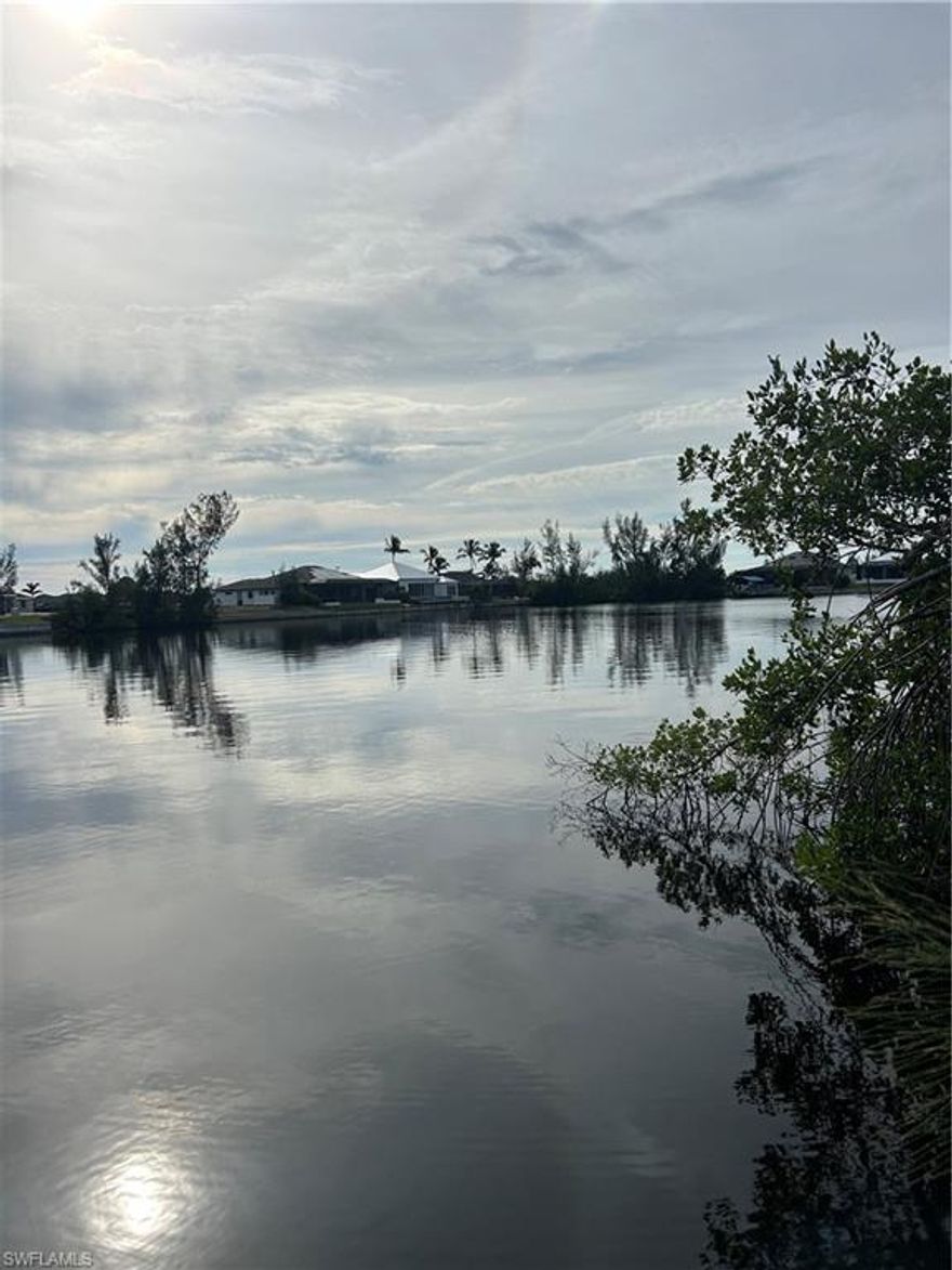 Come check out this beautiful oversized gulf access lot with SE exposure and is just seconds (literally) from the spreader canal. It sits on a large body of water, approximately 250 ft wide. The lot is located in a highly desirable NW area of Cape Coral. Being just minutes from Matlacha, and with new projects on the horizon like the 7 islands project- do not miss out on this opportunity!