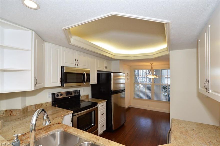 C.14387 - The Beau Chene community is one of Naples' best kept secrets.  Centrally located and walking distance to shopping, it is quietly situated in a one mile circle.  Beau Chene is well maintained and well managed.  This two bedroom, two bathroom condo has had the spacious kitchen and baths updated.  The South facing lanai is just steps to one of the two pools in the community.  The air conditioning system is less than two years old.  The assigned carport, D-103, is close by.