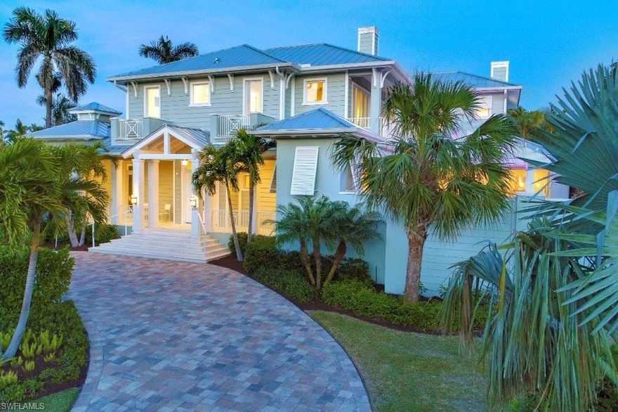 H.12579 Located on one of the most attractive & quiet streets in the Moorings, marvel this new, never lived in, Clive Daniel professionally decorated, Coastal Contemporary beauty! Instant family & friend unification abounds within a light & bright great-room w/fireplace and rich, smoked oak hardwood flooring incorporating the outdoors in from your large family-room style lanai having a second fireplace gathering area, full bath, large dining area & outdoor kitchen. The sunny pool deck exposure faces desired Southwest boasting sizzling sunsets amongst colorful LED pool lighting, pergola covered private spa & tranquil, modern bowl fountains! Delectable, Sand Dollar award winning island kitchen features custom cabinets, polished Quartzite countertops, Viking 6 burner gas range w/ 2nd wall oven, Subzero paneled refrigerator, Bosch dishwasher & large wine cooler. Master suite & study (study has closet, full bath & private entrance-can double as 5th bedroom!) downstairs - upstairs delights w/3 large ensuite bedrooms, TV gathering area plus dining/game booth. Walk, cycle or drive to the Moorings breathtaking private member beach nearby!