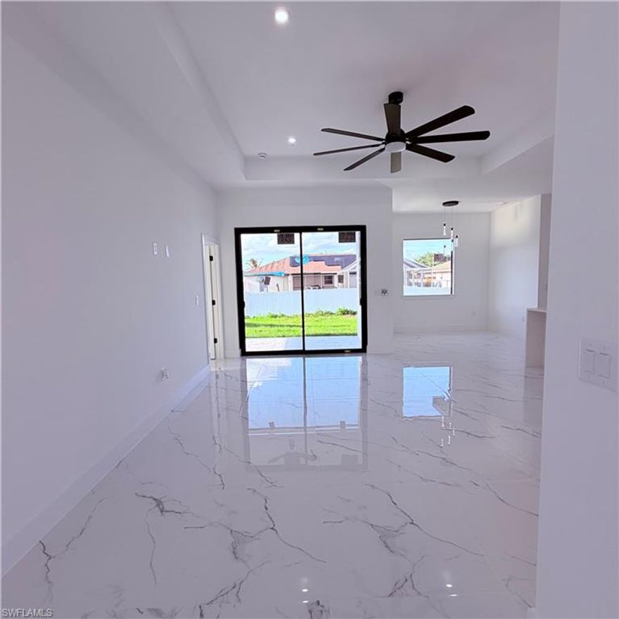 This stunning modern all-white residence showcases sleek design and high-end finishes throughout, offering an abundance of natural light that fills every space with warmth and elegance. The heart of the home features a spacious open-concept kitchen with a large center island, complemented by ample white cabinetry, creating a bright and functional space perfect for entertaining.
The luxurious master suite is a true retreat, complete with dual “his and hers” walk-in closets, providing generous storage and convenience. The home also includes an epoxy-finished garage, combining durability with a clean, polished look.
Step outside to enjoy the expansive lanai, fully equipped with an outdoor kitchen—ideal for hosting gatherings year-round. The spacious patio offers both sun and shade, enhanced by a well-maintained landscape supported by an automatic sprinkler system.
This home perfectly blends modern style, comfort, and functionality for exceptional indoor and outdoor living.