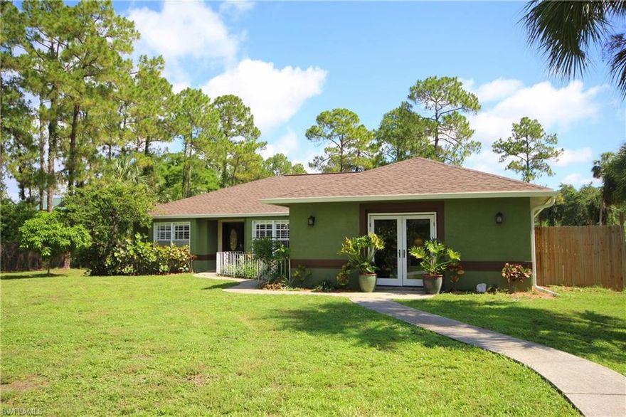 Experience Luxury Country Living at it's best! You must see this Custom Designed Home in Golden Gate Estates! Over 2 acres of Privacy and Storage Options amidst Tropical Landscape and plenty of Fruit Trees! Electric Gated entrance and Circle Driveway greet you in this 3 Bed/2 Bath home with over 2040 sf. New Custom Kitchen features Stainless Steel Appliances, Granite Counters, Backsplash and Breakfast Nook! New in 2016: Roof with 30 yr. transferrable warranty and Seamless Gutters and Downspouts! Entire home has New Tile floors, New Paint, New Light fixtures, Bose Audio System, 5" Baseboard and Crown Molding, Plantation Shutters, Updated Bathrooms, Kenetico Water System(2010), A/C replaced in 2008. Screened-In Salt Water Pool with Limestone Deck offers a Spacious Sitting Area and did you see the Bar? 1800 sf. Commercial Grade Out-Building with Mercury Lights and 400 Amp Electric (2007), RV Pad with hook-ups, 6 ft. Chain Link Fence surrounds lot. Close proximity to the new Publix, Golden Gate Bridge, Ave Maria and the much anticipated Rural West and Rural West Town Center, with paved access to Jung Blvd and 16th Ave NE. Don't miss this rare opportunity! Make your appointment today!