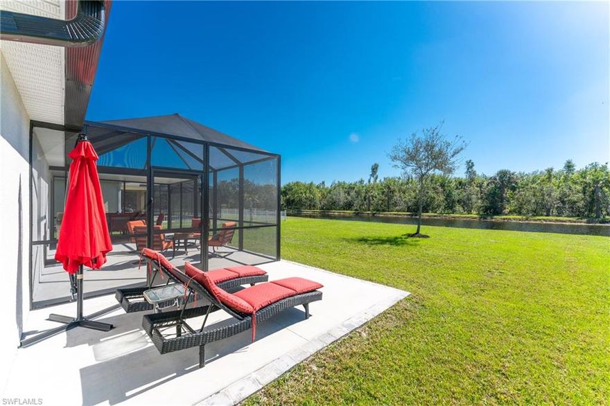 It will be easy to say yes to this beautifully appointed waterfront home. Nestled on a picturesque lot overlooking a tranquil lake with a lush vegetative backdrop within the gated community of Calusa Creek. This three bedroom home is being offered with an ATTRACTIVE TURNKEY FURNITURE PACKAGE - with exceptional decor throughout! This 2019-built home boasts a BRAND NEW ARCHITECTURAL SHINGLE ROOF. You will be welcomed into this impeccably maintained home by a pleasing front door with glass accent. Here you will discover a desirable floor plan accentuated by neutral tile and walls - topped with crisp crown moldings and a dramatic pop of color on select accent walls. Carefully selected fixtures compliment the handsome decor. The kitchen enjoys an expanded collection of wood cabinets with lots of storage, stone tops, stainless appliances, wine chiller, and three-dimensional accent wall tile. You can easily move the party outside to the expanded lanai with a new enclosure, including undercover and sun areas to lounge with a refreshment in hand. No doubt this will be a favorite spot to relax as you bask in the warming sun offered by this slice of paradise boasting southern exposure.