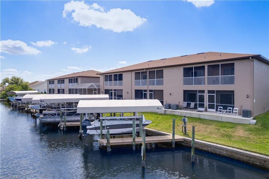 Welcome to your dream townhome in Cape Coral! This stunning property boasts 2 bedrooms, 2.5 bathrooms, and a 1 car garage, perfect for those looking for a cozy yet spacious home. The community pool is perfect for relaxing on hot summer days, while the granite counters and stainless steel appliances in the kitchen make cooking a breeze. With Gulf access and 2 screened lanais overlooking the dock and canal, you can enjoy the beautiful waterfront views right from your own home.

Storage space is no issue here, with plenty of room for all your belongings, including a decorative concealed storage space under the stairs. Bring your furry friends along, as this townhome is pet-friendly. The assigned boat lift and canopy with cover make boating a breeze, and the beautiful remodeled interior is sure to impress.

Whether you prefer to enjoy your morning coffee or an evening cocktail while watching the sunrise or sunset, this townhome has it all. Just 15 minutes to the Gulf, you can easily take a boat ride through Gloriana Canal to waterfront restaurants or shopping at Cape Harbour and Tarpon Point Marina. Don't miss out on this incredible opportunity to live the waterfront lifestyle in Cape Coral!