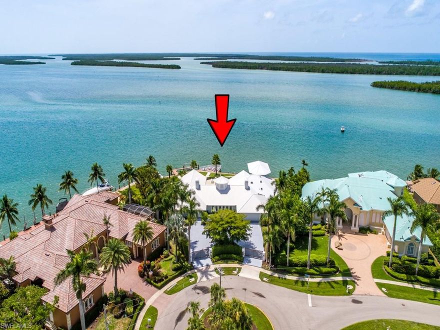 Cross the threshold through the custom gates & expect to be astonished by the “Lands End” seaside estate w/ extraordinary views of the Gulf, Ten Thousand Islands & Caxambas Pass! With the wonder of a private tropical oasis, located at the southernmost point of Marco Island, this location showcases nature, with no residences in sight!! This gorgeous courtyard residence was recently renovated w/ coastal chic elements designed to capture the feel of a Caribbean resort, truly breathtaking waterfront views that extend for miles, w/ southern exposure & 265’ of seawall! The pool & waterfront is showcased from most every room, there is a spacious “great hall” for formal living & dining, w/ newer oversized Turkish limestone flooring, tongue & groove wood ceiling & fireplace. Step into a massive gourmet kitchen w/ luxury appliances & enjoy vaulted ceilings & wall of windows in the family room & informal dining areas. The formal master bedroom in the west wing has incredible views in 3 directions showcasing both sunrises & sunsets, it has an opulent master bath & the guest quarters are in the east wing. Plus there is a theater room, 2nd story office & lanai, outdoor gazebo and dock!