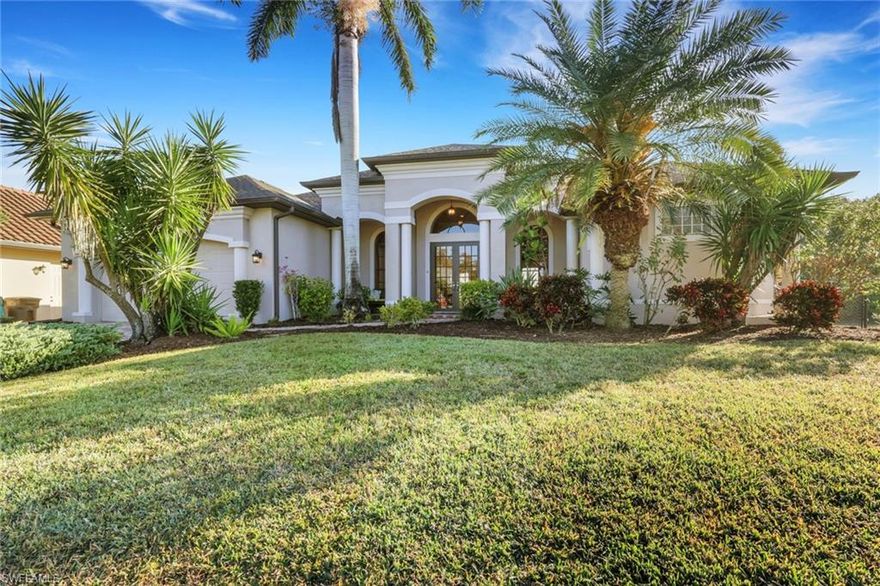 Experience the perfect blend of architectural detail and resort-style living. Nestled in the heart of the Coral Oaks Golf Community, this custom estate greets you with soaring 12-foot backlit tray ceilings and grand columns. The heart of the home is a gourmet kitchen featuring granite surfaces and a walk-in pantry, perfectly situated for hosting in the adjacent formal dining room and a dedicated wet bar designed for seamless entertaining.
The interior flows outdoors through 90-degree "vanishing" sliders that lead to a private sanctuary. Relax on the expansive pavered lanai, take a dip in the custom infinity-edge pool, or unwind in the integrated spa. The property offers total peace of mind with a new roof installed in 2023 and a brand-new fence added in 2025 for ultimate privacy. With a newer 20' dock and the clubhouse just a short walk away, your Florida lifestyle is ready today. This home is meticulously updated with fresh custom paint, newer appliances, and a modern security system. For a truly turn-key transition, the seller is willing to include the furniture as part of the sale.