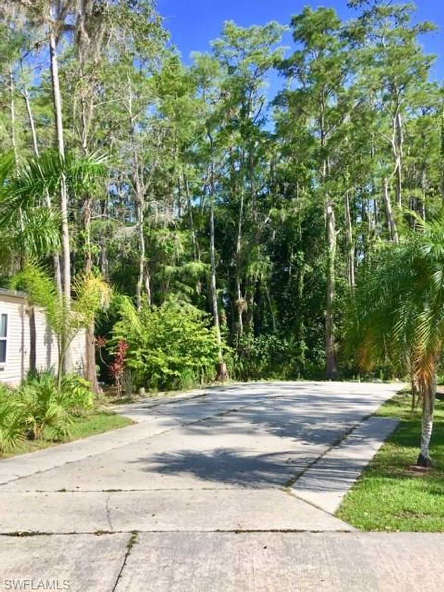 Exclusive lot for sale inside the Corkscrew Woodlands gated community. This 55+ community offers conveniency and privacy while being centrally located in one of the most active adult communities in town. Located just minutes to RSW International Airport, I-75, Naples and Downtown Fort Myers. This clean, concrete slab-lot comes equipped with water, electric hook-up, natural shade, etc. Amenities include a community pool, bocce courts, BBQ area, tennis courts, pickle ball, fitness area, and more. YOU OWN LOT - NO RENTAL FEES.