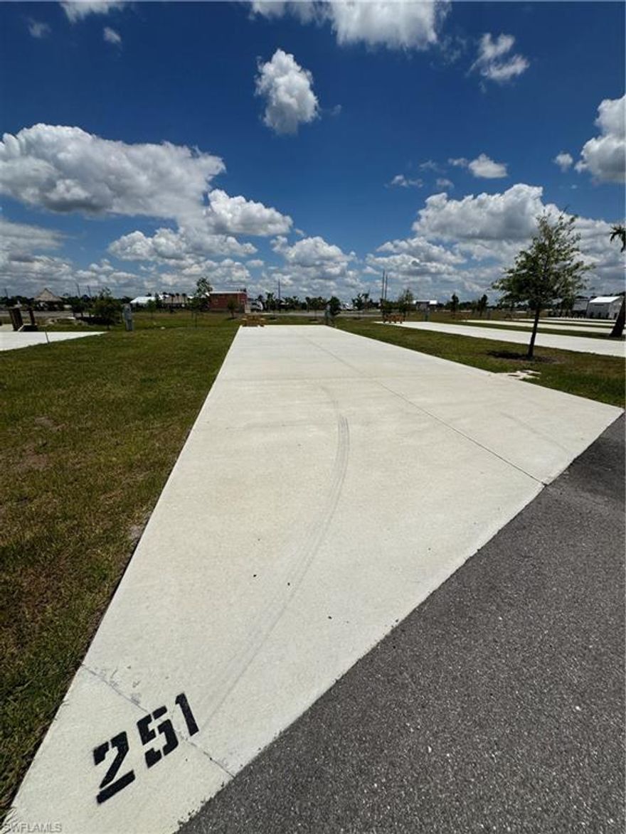 Lot 251 at Palm Breeze RV Resort is an highly sought after waterfront RV lot offering a functional layout creating flexibility for RV placement and enhanced outdoor living with tranquil water views. Priced to sell quickly, do not miss out on this one!!
Palm Breeze delivers a true resort-style experience with thoughtfully designed, upscale amenities that elevate everyday living. Residents enjoy a beautifully appointed clubhouse that serves as the social heart of the community, a resort-style pool and spa with a relaxing, vacation-inspired atmosphere, and a fully equipped fitness center designed for both casual and dedicated routines. Outdoor recreation includes professionally maintained pickleball courts, scenic walking areas, and a well-designed dog park, while curated community events and an active social calendar create a vibrant, connected lifestyle. The gated setting enhances privacy and exclusivity, offering a polished, welcoming environment that reflects the community’s luxury appeal.

Located in Punta Gorda, this property places you just minutes from one of Southwest Florida’s most charming waterfront downtowns, featuring Fishermen’s Village, boutique shopping, local restaurants, farmers markets, and the scenic Harborwalk. With Punta Gorda Airport approximately 2 miles away and easy access to Venice, Fort Myers, Boca Grande, Englewood Beach, and Sanibel, Lot 261 offers not only an exceptional homesite but a refined coastal lifestyle in one of the region’s most desirable RV communities.