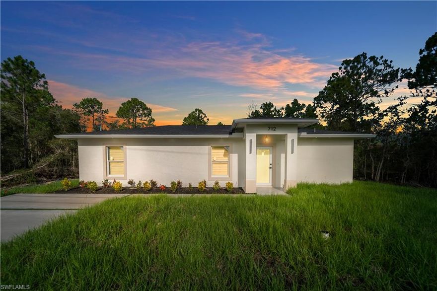 Modern home featuring stylish light fixtures and elegant window treatments throughout. Impact-resistant doors and windows provide added safety and peace of mind. Enjoy beautifully designed modern  bathrooms and a spacious backyard with a covered terrace, perfect for outdoor living and entertaining. Move-in. Some photos are from a different listing with the same floor plan.