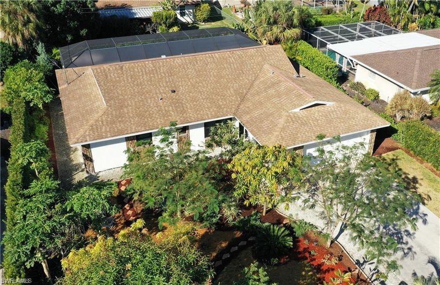 Naples Prime Location, less than 10 mins from the gulf beaches. Bright and airy, this 4 bedroom with newly renovated bathrooms home sits on a quiet street in the popular community of Palm River in North Naples. NO HOA fees or restrictions!!! X ZONE (OUTSIDE THE FLOOD ZONE). A gorgeous perfect maintained garden with multiple fruit trees that includes mangos, bananas, avocados, papayas, Florida strawberry bush and much more. The property has a separate well for irrigation system that was settled (no monthly fees). Newly installed large pool with screened enclosure was built in 2023 with a separate enclosure for any type of pet. This just under 2,000 sq. ft of living space home has a neutral palette with brand new modern floors, making it the perfect place to add your own touches. French doors open up to a completely fenced in yard, perfect for pets, kids or just the privacy you've been looking for. The backyard views face west, which makes for nightly breathtaking sunsets from your new home. This 2 car garage and .23 acre lot with private well irrigation. It's a perfect to move right in or purchase as an investment home. Conveniently close to everything in North Naples including dining, retail, multiple grocery stores. Plus, you're in a Top A rated school zone!