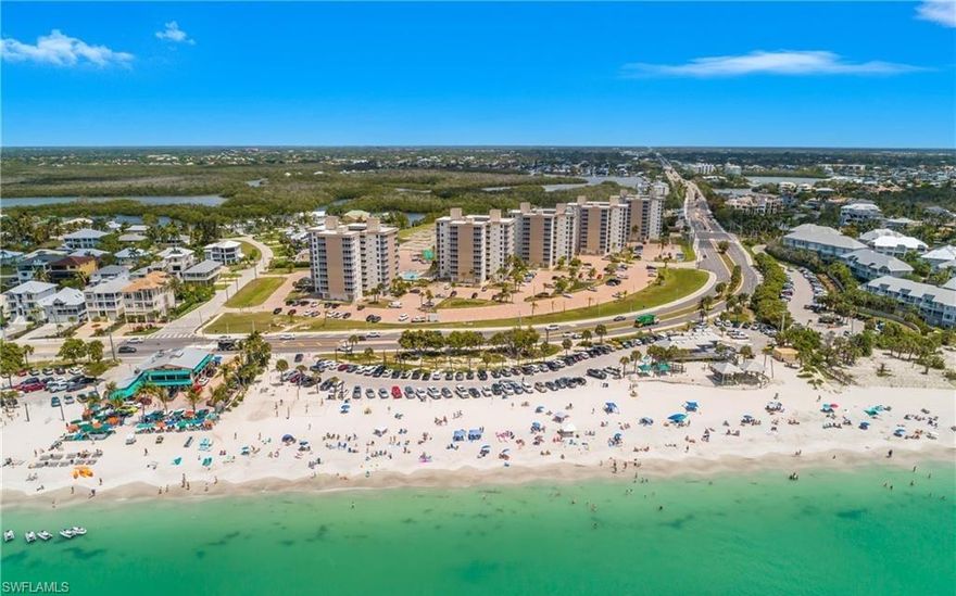 Coastal Paradise Condo – Completely Renovated Beach & Bay Retreat/Condo - This completely renovated beachfront condo offers stunning views of both the Gulf and the bay and is ideally located just steps from Barefoot Beach, Doc’s Beach House, and Coconut Jack’s. Renovations include a New Hurricane Rated Windows and Doors (5-2026), New HVAC (4-2026), breaker panel and wiring, updated ceilings and flooring, new cabinetry and countertops, a fully appointed kitchen with upgraded appliances, a tile walk in shower, an endless hot water tank, and a newly added washer/dryer combo. This turnkey unit features many premium upgrades a king size Karma Moon mattress, two large, upgraded closets providing ample storage, a living area with a queen sleeper sofa, and a 50" TV visible throughout the space. The exterior balcony has been updated with a new cage and screen. Bonita Beach and Tennis Club has undergone significant recent improvements, including renovated courtyard areas and heated pools. New Landscaping is coming soon. With nearby access to beach activities, waterfront dining, and jet ski and boat rentals, this residence offers an exceptional coastal lifestyle. This is a must see unit—call today to schedule your private showing. This unit is located in a outstanding rental area or for your own personal use. Your Fully Renovated Beach Escape is Waiting for You!