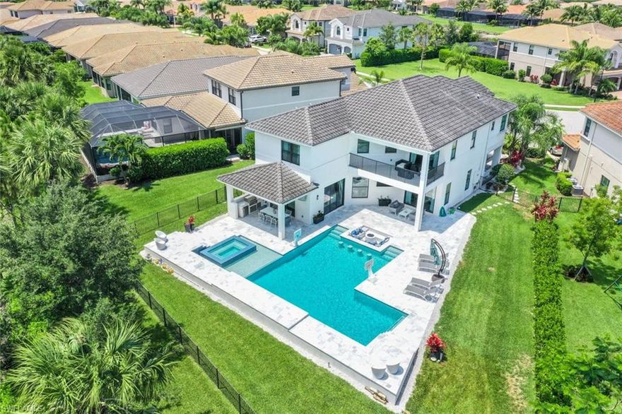 A Gem in Stonecreek! This beautifully appointed Shiraz has it all.  But the heart of this home is found in the POOL! Meticulously designed by the owners, the custom large pool & Spa, will create an ambiance of the ultimate Florida lifestyle. This outdoor pool area boasts a sunken gas fire pit with cushioned seating to be enjoyed day or night. This textured marble outdoor living space has plenty of seating, lounging & entertaining areas. Enjoy music from a SONOS audio system, multiple TVs, or 2nd fire pit for smores. Inside, gather around a Custom Marble island or next to the 60-bottle wine cooler! Custom 54”cabinets with lighting, subzero & wolf appliances & walk-in pantry set this home apart from others. Elegant mirrors, woodwork, marble accent wall with gas fire feature, add character to the living & dining areas.  Upstairs, a pleasant surprise awaits as you enter an extra-large Loft with wet bar & wine cooler. Hardwood Floors & tile throughout define the luxury this home exudes. The owner’s suite features ample closet cabinetry and beautiful balcony overlooking the pool. Upstairs laundry room with cabinets galore, & several en-suite bedrooms makes this home the ultimate definition of comfort, elegance, and coveted lifestyle you want and deserve! Stonecreek is an amenity rich community which offers resort style pool, lap pool, spa, cabanas, indoor/outdoor basketball, tennis, pickleball, exercise room, rec room & more.. So, the only question is, if not now when?