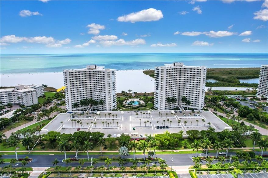 AMAZING GULF VIEW! Island living at it's best... this end unit has stunning views of the beach from almost every room in the home. Tastefully updated w/ a contemporary "seaside" flair and being offered TURNKEY. Wonderful great room layout with a wide galley kitchen w/ breakfast nook balcony, all tile flooring, custom closet cabinets, renovated baths, and spacious bedrooms w/ the master having sliders to the long Gulf facing balcony. Situated in a gated community that has resort style amenities along w/ the ability to lease a boat dock if needed.