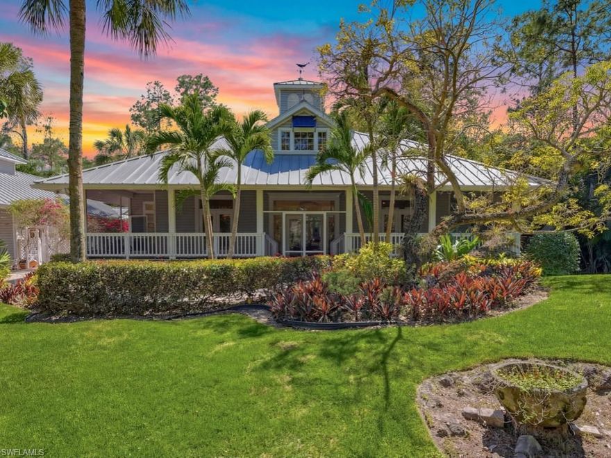 Tucked behind a gated entry on 2.5 acres of lush, wooded privacy, this exceptional Naples estate offers a rare and versatile opportunity with a primary residence and a guest residence, each with its own pool, perfectly suited for guest accommodations, multi-generational living or income-producing potential. The main residence embodies Florida charm, featuring a welcoming front porch, rich wood flooring throughout the main living areas, and seamless indoor-outdoor living. Designed for both everyday comfort and effortless entertaining, the home offers an array of flexible living spaces, including a formal dining room, living room, family room, and an expansive bonus room ideal for a media lounge, fitness studio, or game room. Outdoors, a large, screened lanai, custom-designed pool, and an outdoor equipped summer kitchen with built-in grills create a private retreat framed by mature, tropical foliage. Upstairs, the second floor is dedicated to a luxurious primary suite—your own private sanctuary—complete with custom walk-in closet and a spa-inspired ensuite bath, all finished in a timeless, understated aesthetic. Equally impressive, the fully detached guest residence offers approximately 1,480 square feet under air and its own private driveway. This spacious home lives like a residence of its own, featuring a primary bedroom with ensuite bath, large living room, full kitchen, dining or flex space, den, and a generous screened lanai with its own private pool. Ideal for extended family, long-term guests, or as a potential income-producing rental, it provides exceptional flexibility without compromising privacy.  Southern exposure with expansive acreage, and a peaceful, Olde Naples style setting just minutes from Naples’ Gulf beaches, shopping, and dining, this one-of-a-kind property delivers the perfect balance of seclusion and convenience. Estate opportunities like this in Livingston Woods are rare—where design, space, and versatility come together in a truly extraordinary offering.