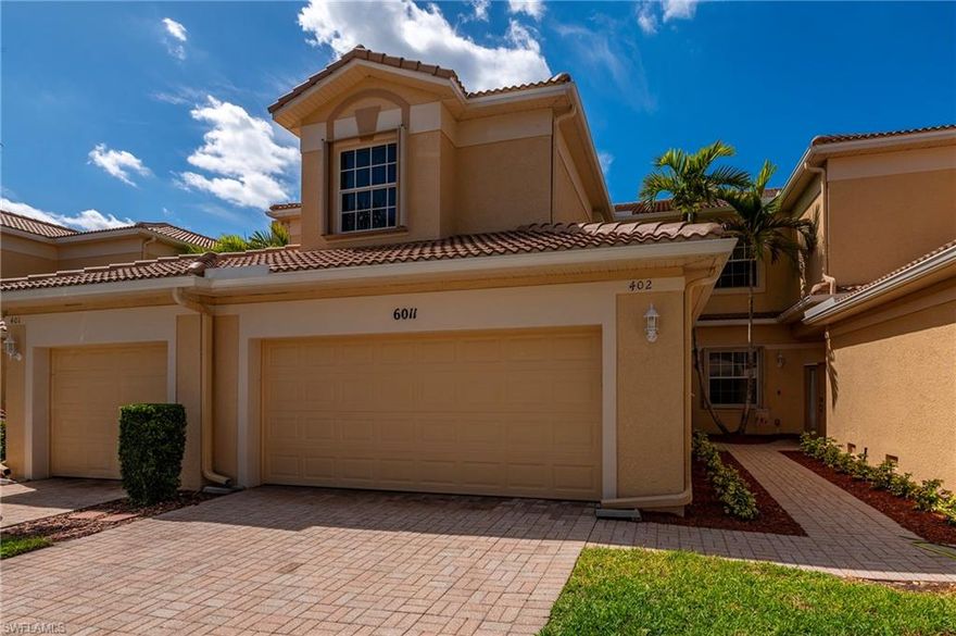 LOCATION, LOCATION, LOCATION! Tucked inside the gated community of Jonathan’s Bay, this beautifully maintained second-floor carriage home offers peaceful lake and fountain views overlooking the community pool from the private screened lanai. With 4 bedrooms, 2 bathrooms, and over 2,000 square feet of living space, this residence blends spacious comfort with low-maintenance Florida living in an ideal Fort Myers location close to beaches, shopping, dining, and the airport for easy weekend travel.

This light and inviting home has been gently used as a seasonal residence and has never been rented. The spacious layout includes a 2-car garage, partially furnished interiors, and a relaxing lanai protected by an electric roll-down Storm Smart screen system, while accordion shutters provide added storm protection throughout the home.

Recent updates include new interior paint and carpet throughout completed in 2022, along with a replaced garage door opener in 2021. The association recently completed new roofs in 2024, adding additional peace of mind for future owners.

Residents of Jonathan’s Bay enjoy gated entry, a clubhouse, community gathering spaces, and a resort-style pool area, all surrounded by lush tropical landscaping and serene lakeside scenery.